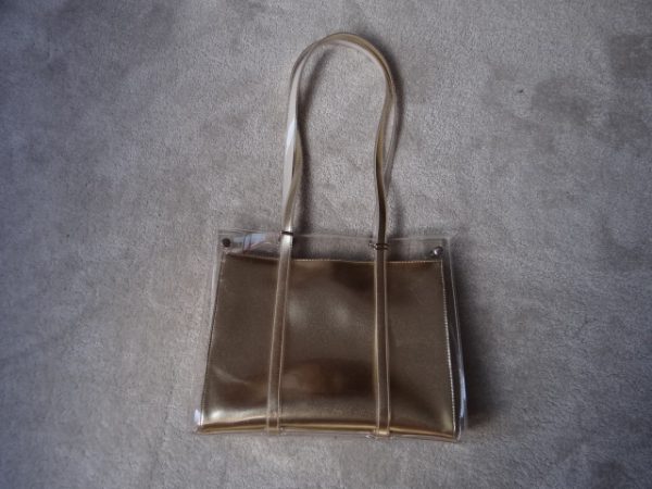 Handbag Gold colour with clear outer cover