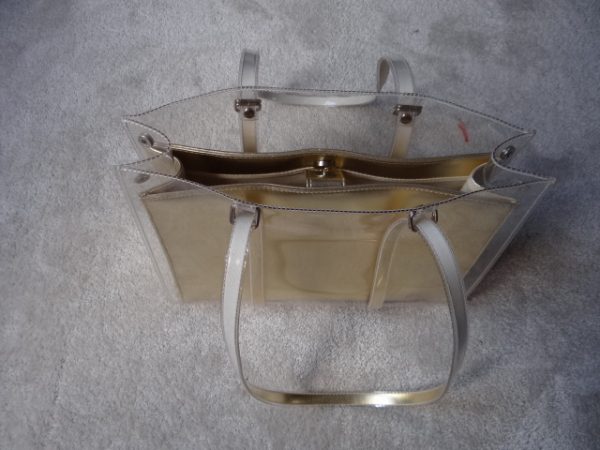 Handbag Gold colour with clear outer cover