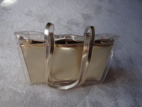 Handbag Gold colour with clear outer cover